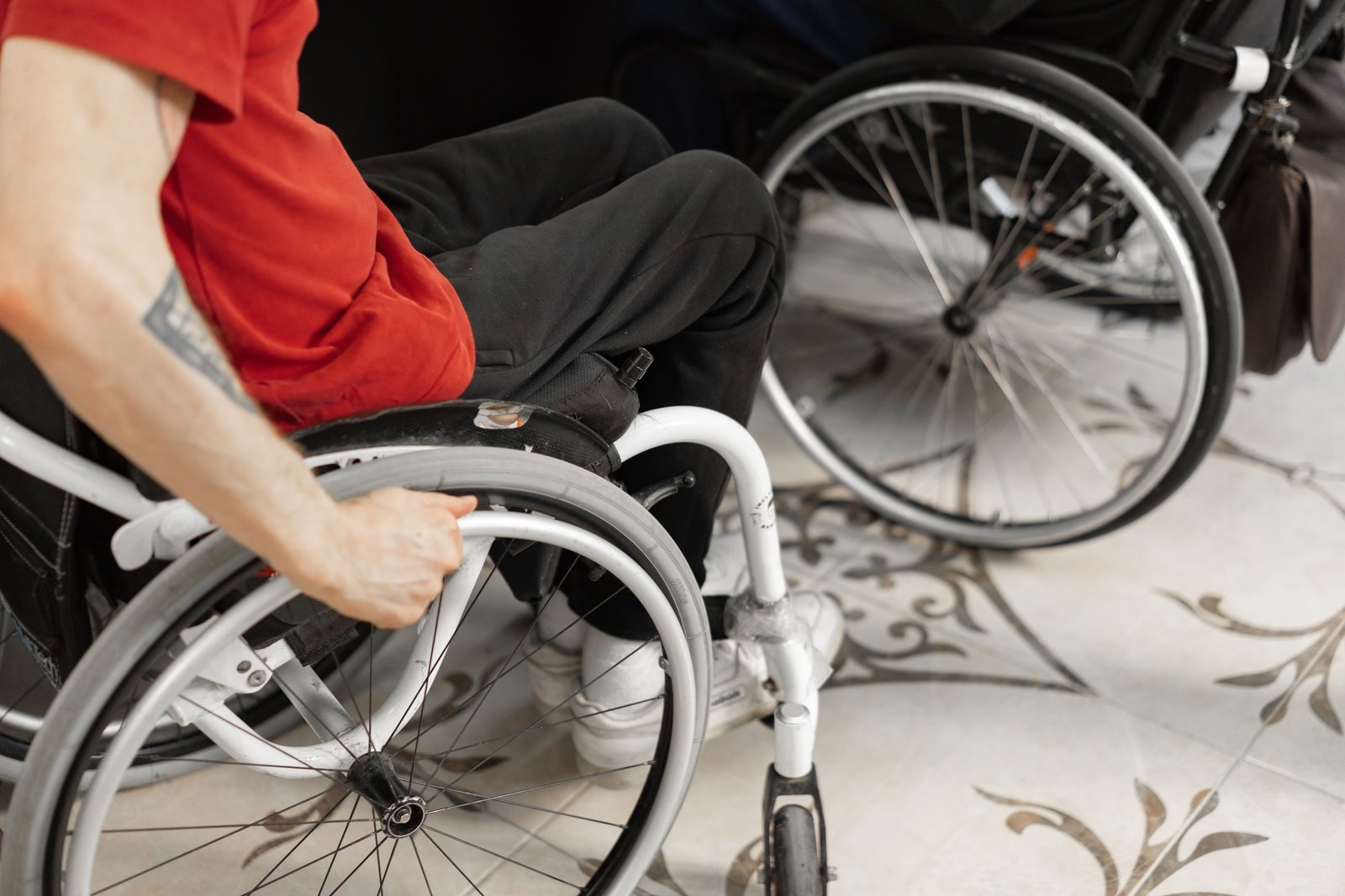 Two people using wheelchairs